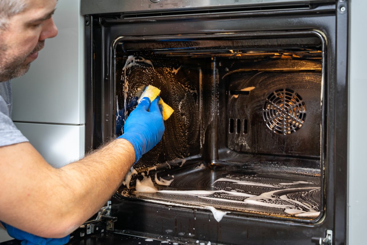 Oven interior being deep-cleaned